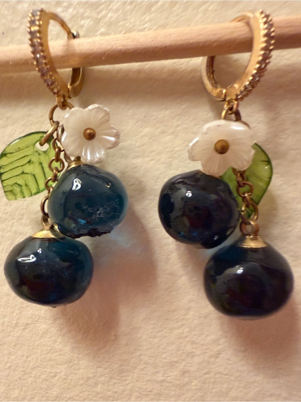 Sweet Glass Blueberry Earrings with small white flowers and green leaves